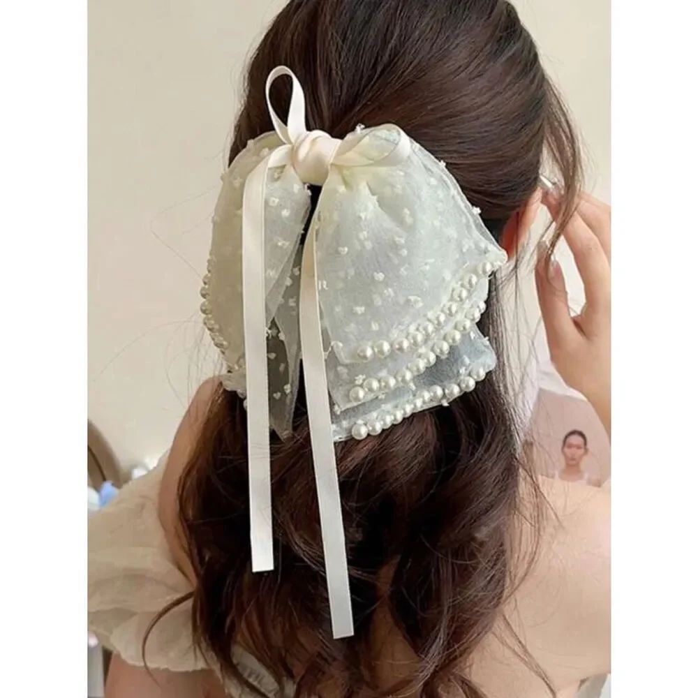 Pearl bow hair clip K48